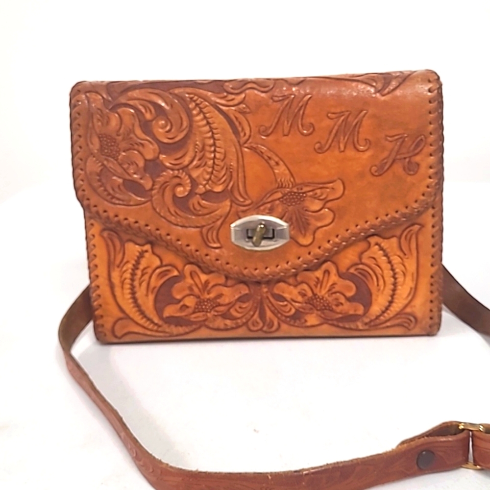 Gorgeous hand toole embossed vintage leather bag in excellent condition.